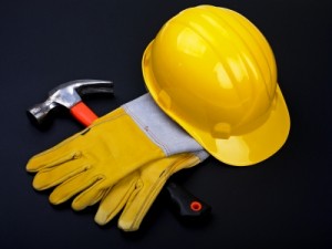 Yellow hard Hat, red hammer and work gloves