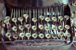 Close-up of vintage Typewriter with letters missing from keys and chipped paint, by Witthaya Phonsawat from freedigitalphotos.net