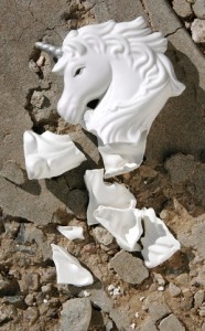 Shattered porcelain unicorn on broken background