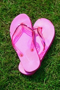 Pink "Flip Flops" on the grass by James Barker on freedigitalphotos.net