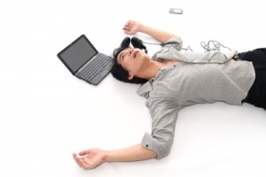 Man Lying on Floor with laptop by  Phaitoon on freedigitalphotos.net