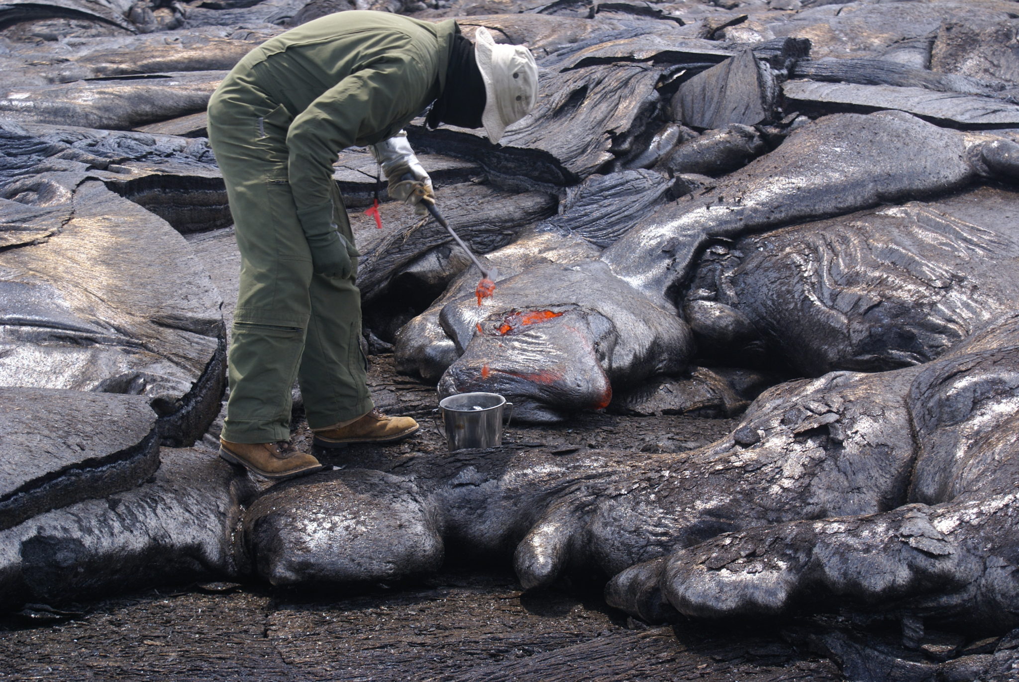 Geologist samples Kilauea lava from http://hvo.wr.usgs.gov/multimedia/