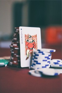 Joker card with stack of chips by Matthew Smith from stocksnap.io