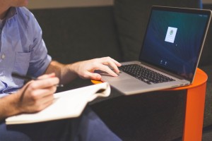 Man working with Laptop and Notepad by Startup Stock Photo from stocksnap.io