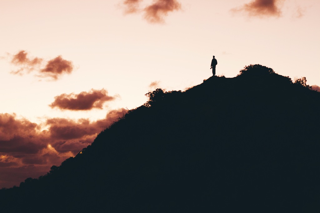 Man's silhouette on mountain by Jordan Hile from stocksnap.io