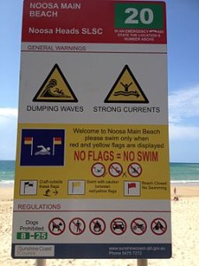 Noosa Heads SLSC sign at Noosa Main Beach by Kgbo, public domain