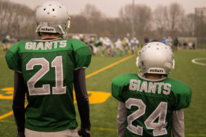 Kids on football field by Skitter Photo from stocksnap.io