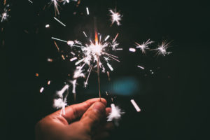 Sparkler held in man's hand by Kaique Rocha from stocksnap.io