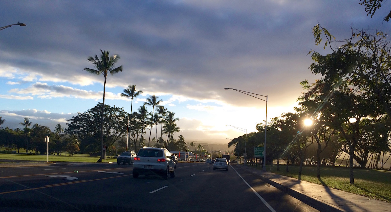 Driving down Kalanianaole Ave toward downtown Hilo by Judy K. Walker