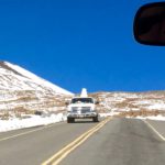 Pickup truck with snowman on the back by Judy K. Walker