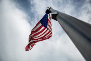 Flagpole with American flag by Christopher Burns from stocksnap.io