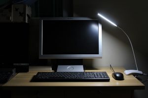 Computer with dim desk lamp