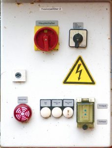 Industrial-looking switches and symbols on a wall