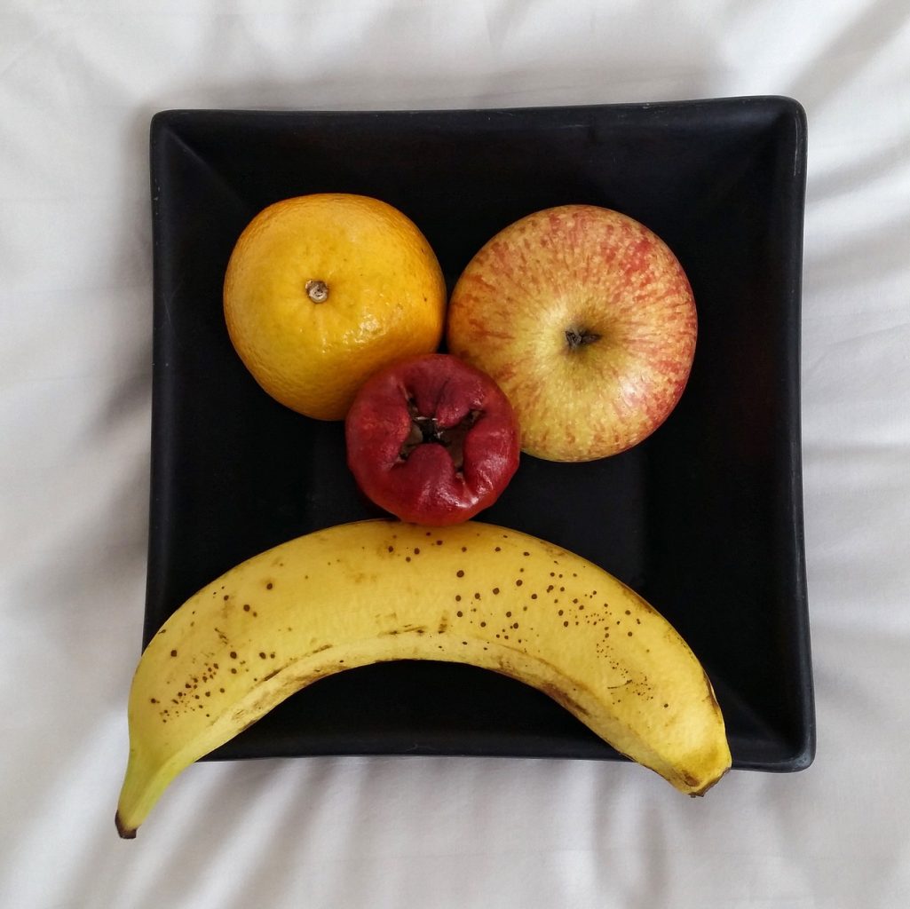 Fruit plate depicting an unhappy face