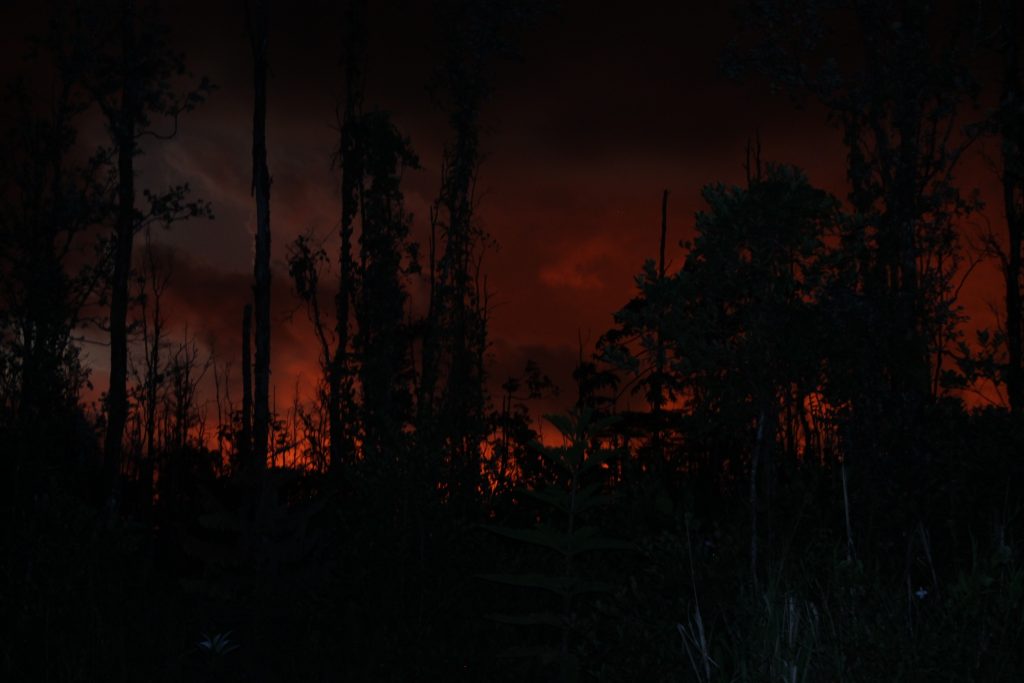 View of the night sky with lava glow in lower Puna, Hawaii Island, on May 30, 2018