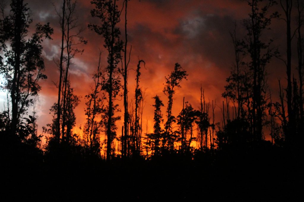 View of the night sky with lava glow in lower Puna, Hawaii Island, on May 30, 2018