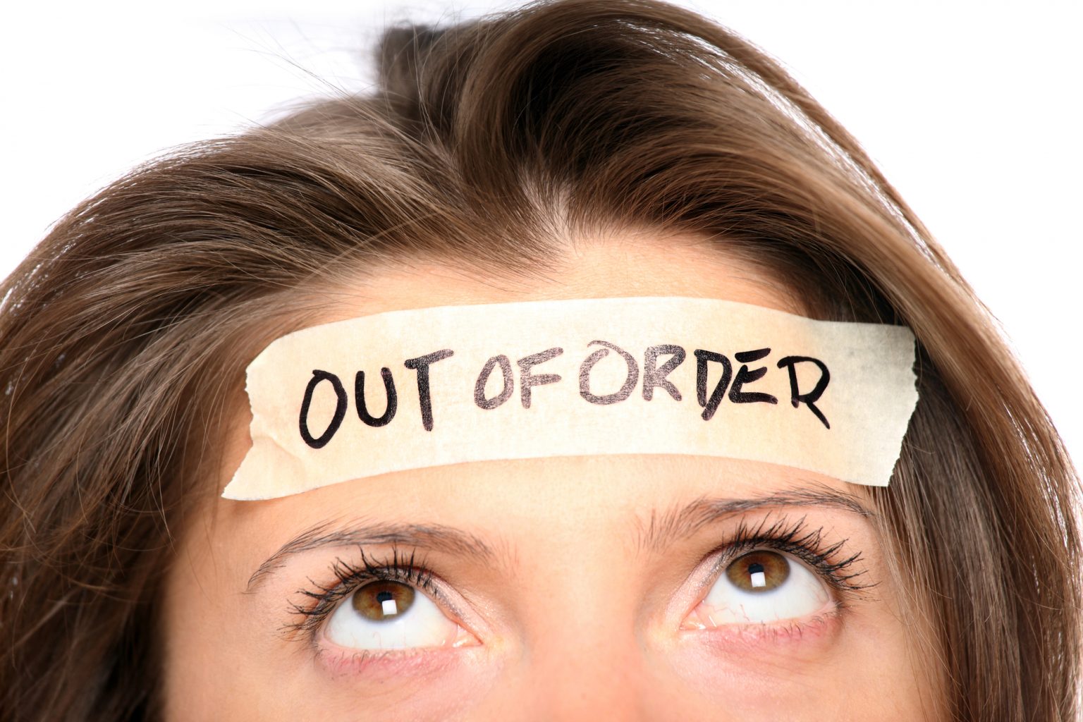 Woman with an "Out of Order" sign taped to her forehead