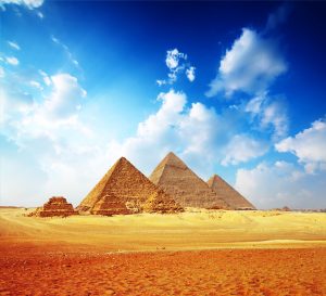 Giza valley with Great pyramids with blue cloudy sky