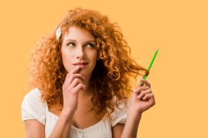 Red-haired woman contemplating